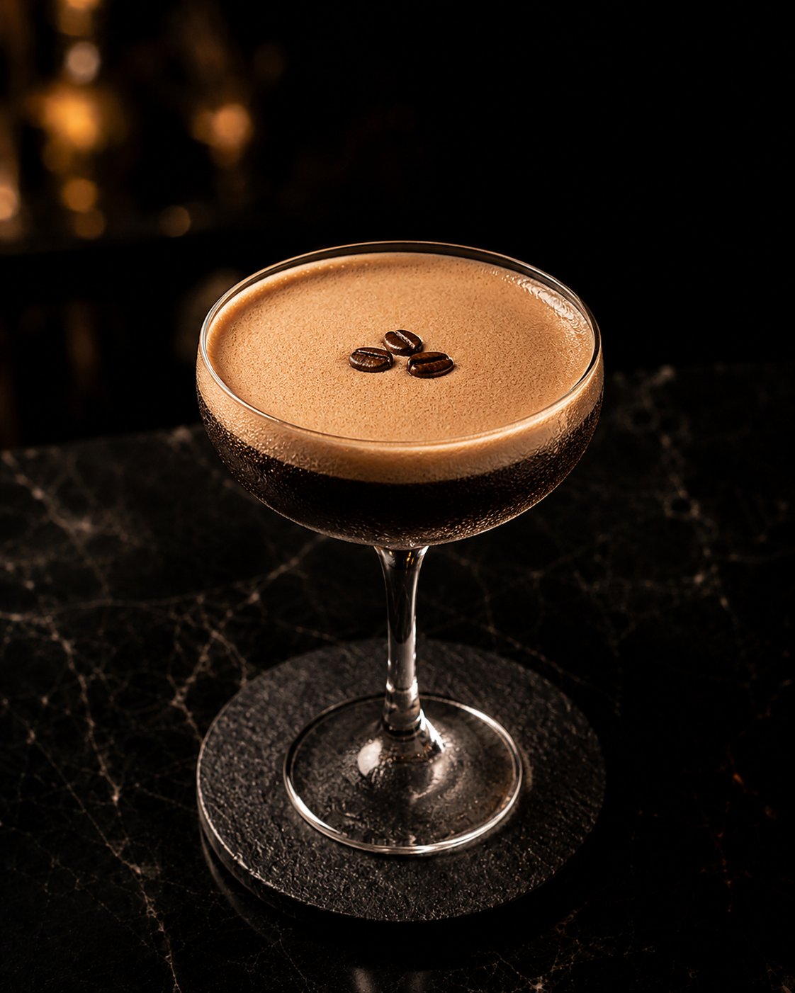 Espresso martini topped with three coffee beans